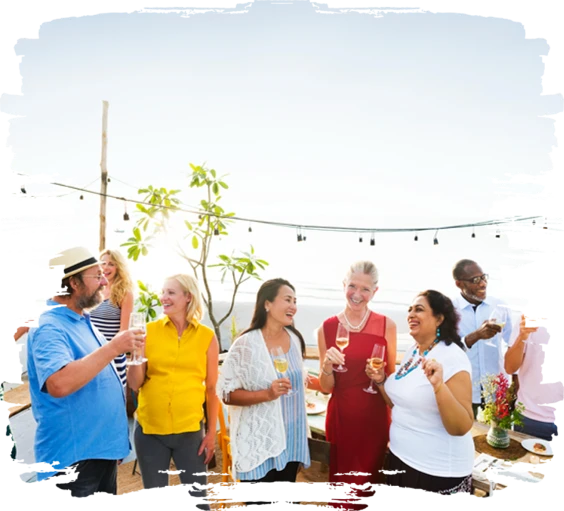Guests raising glasses at an outdoor gathering